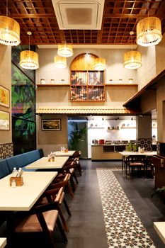 A beautifully lit and stylish restaurant interior with warm decor and modern elements.