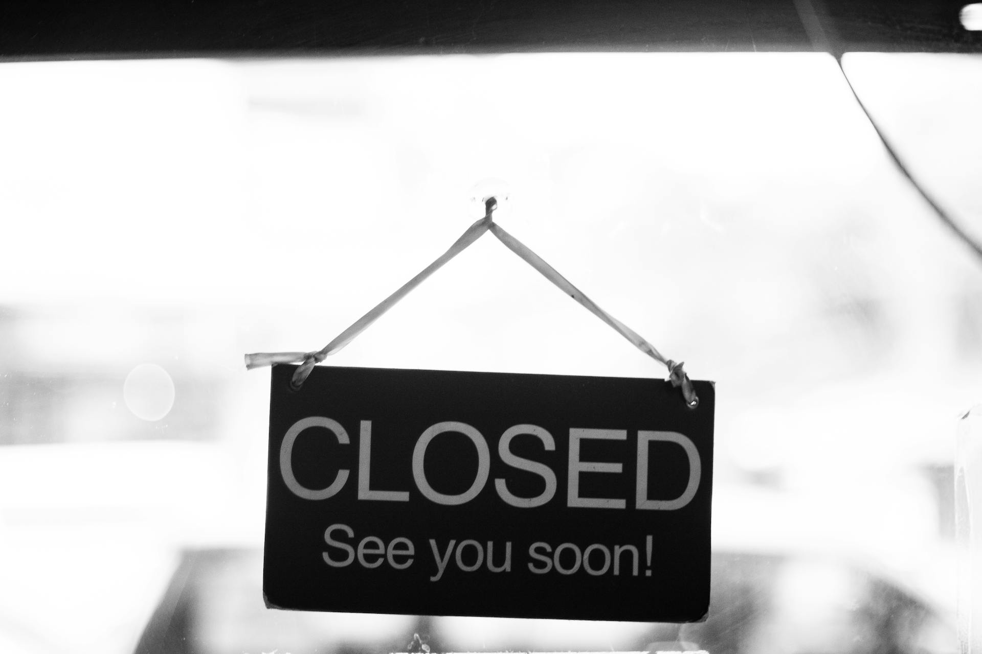 Grayscale Photography of Closed Signage