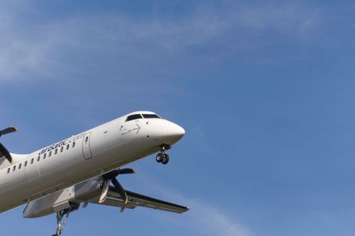 Free Commercial airplane flying against a blue sky over Frankfurt am Main, Germany. Stock Photo