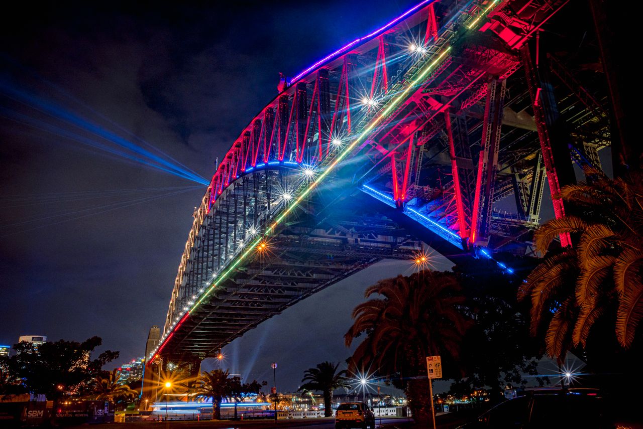 illuminate sydney harbour bridge during a vibrant night festival showc