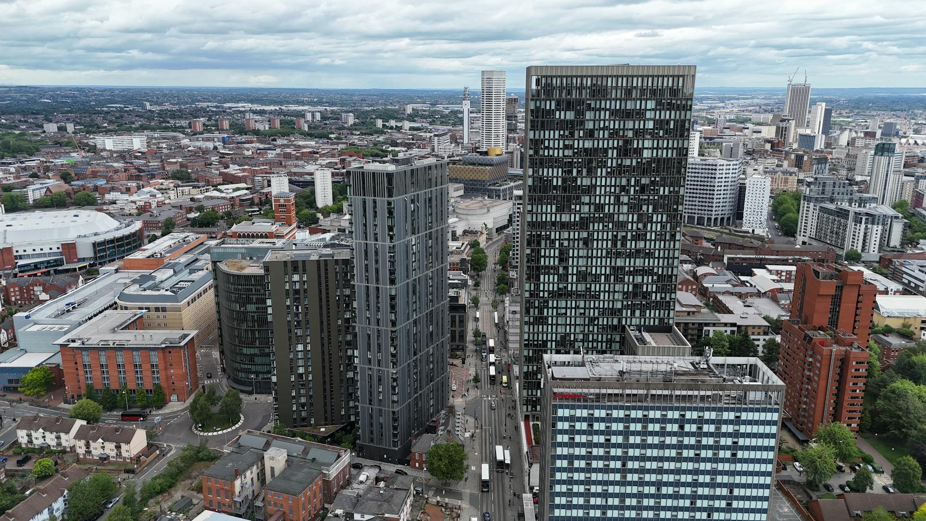Aerial view of modern skyscrapers in Birmingham, England showcasing urban architecture and cityscape.