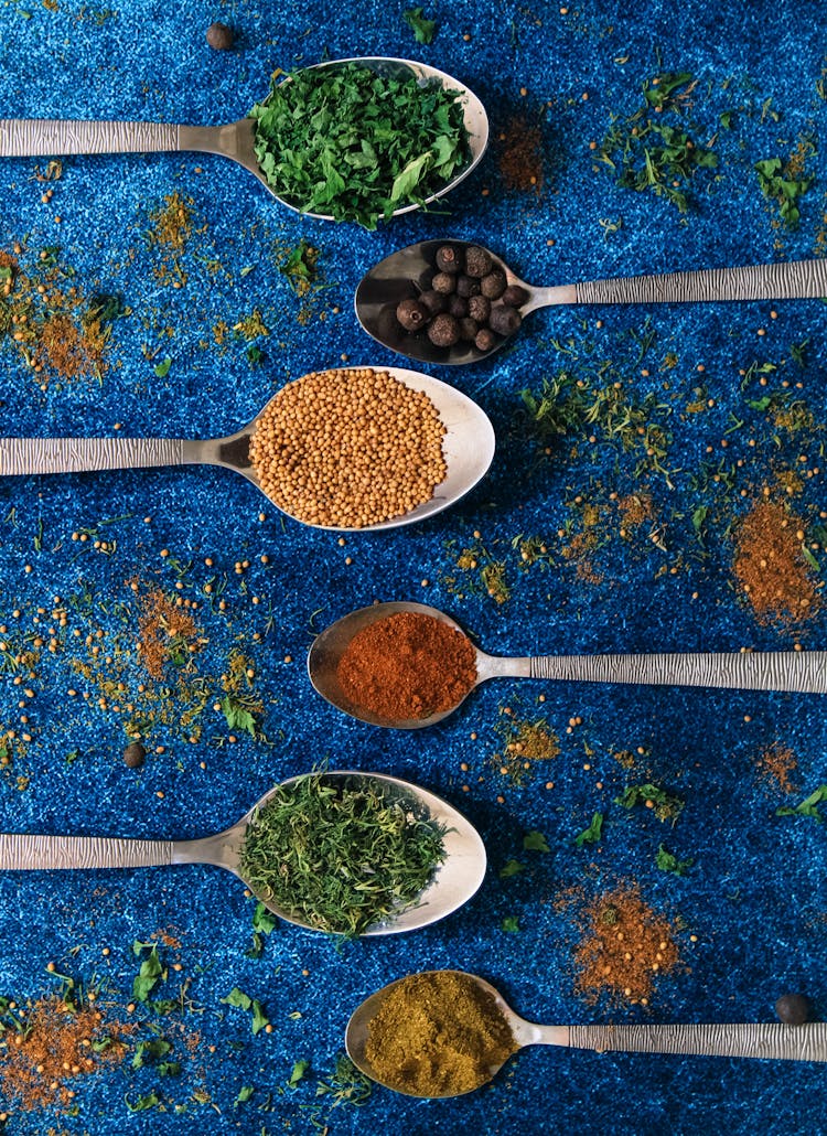 Variety Of Spices On Spoons