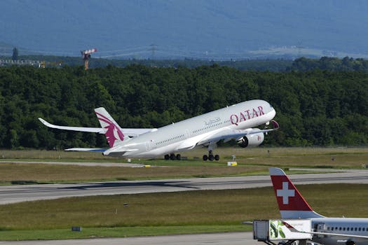 Qatar Airways aircraft taking off at Geneva Airport with Swiss scenery in the background.