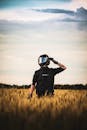 Motorcyclist in Wheat Field at Twilight