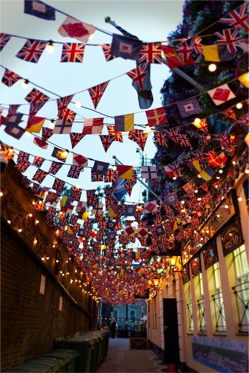 Vibrant Alley with Colorful Flags in London · Free Stock Photo
