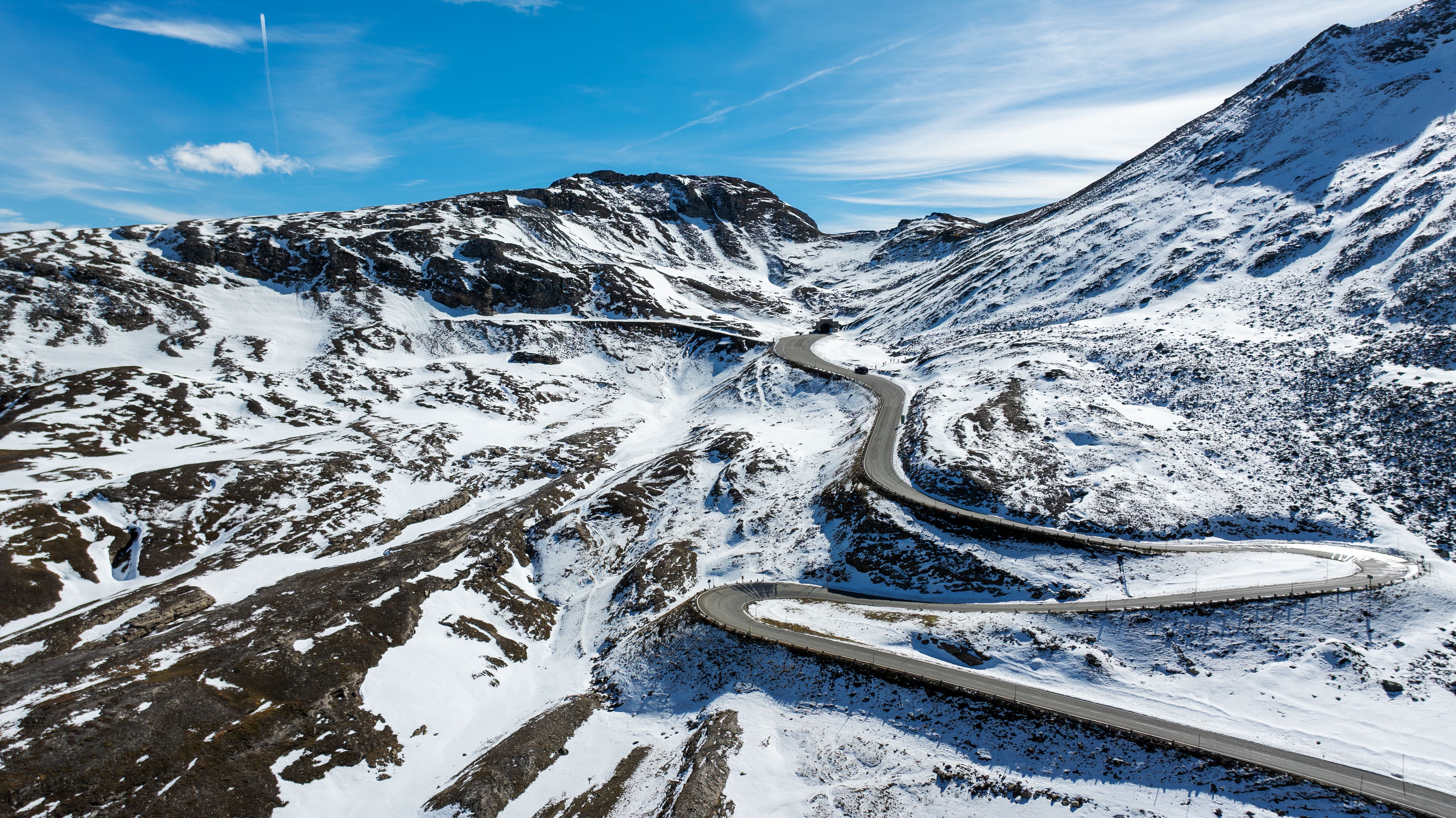 Scenic Aerial View of Snowy Mountain Road in Austria · Free Stock Photo