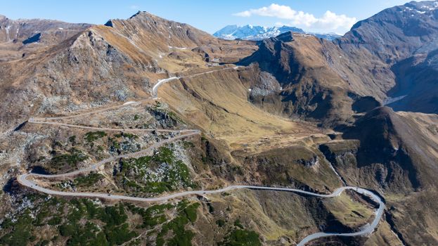 Breathtaking aerial shot of a winding road through the Alps in Kärnten, Austria.