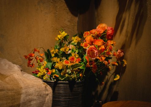 Warm-toned flowers in rustic setting, capturing autumn's essence in Tokyo.