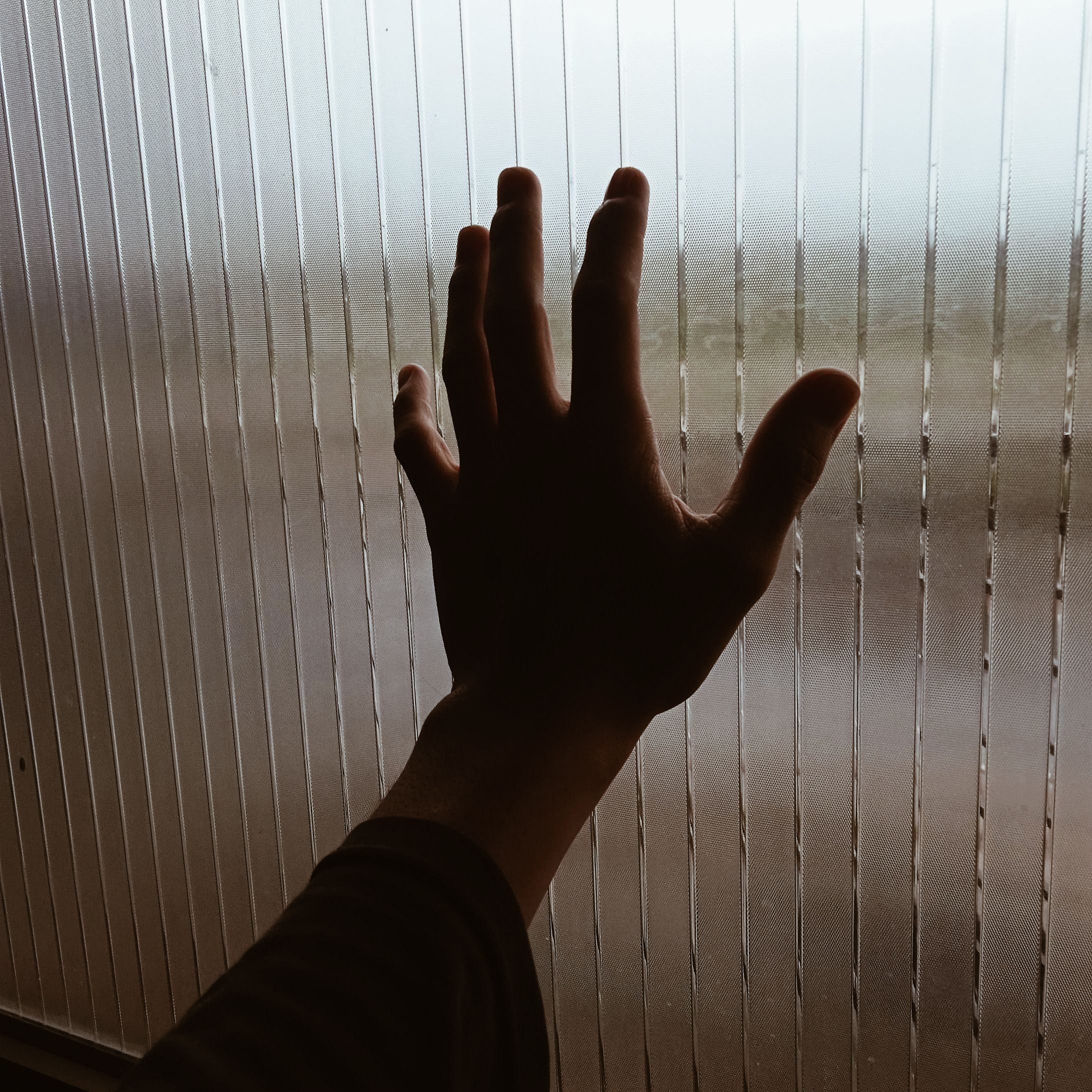 Close-Up Photography of Hand Near Window · Free Stock Photo
