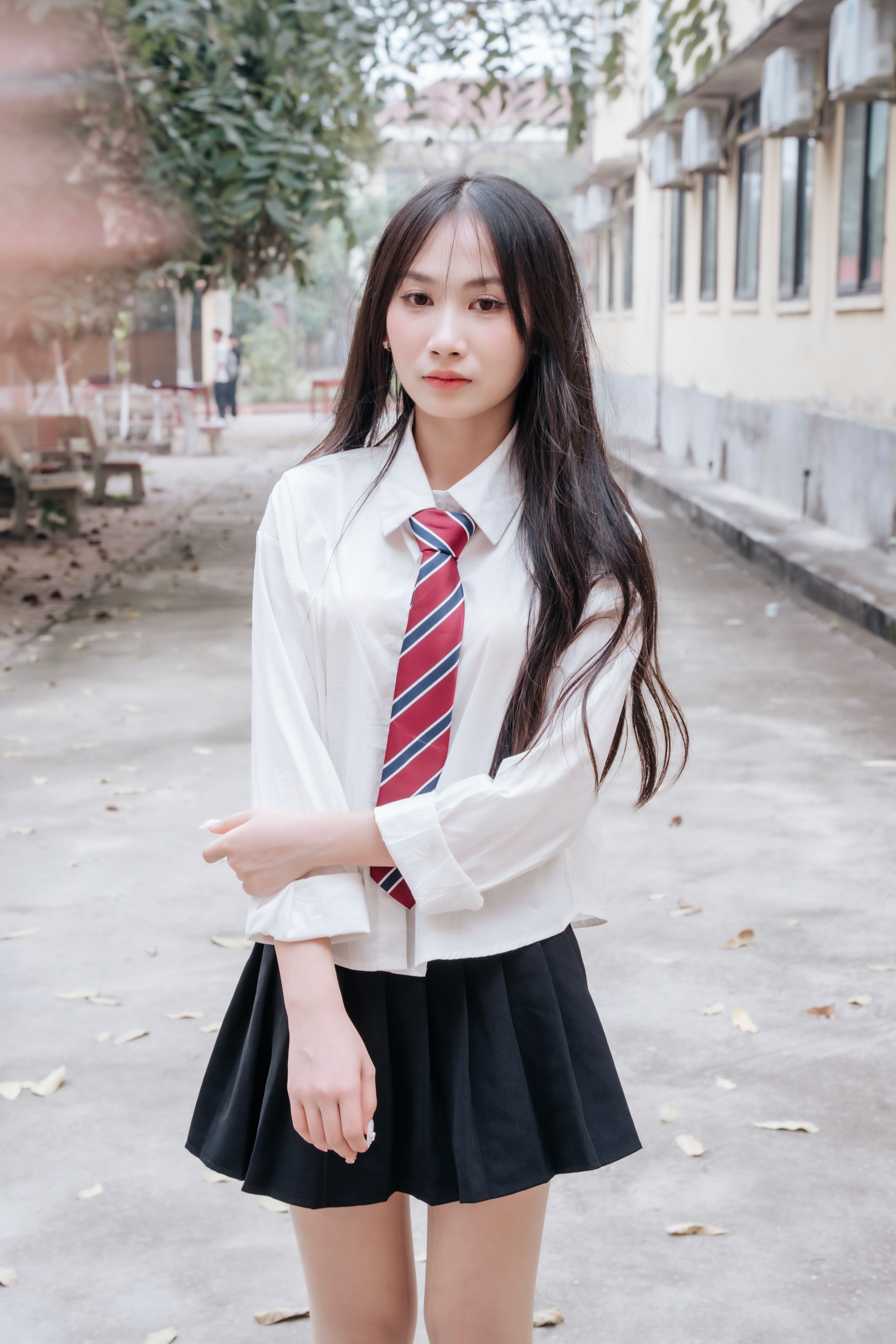 Young Woman in School Uniform Outdoors · Free Stock Photo