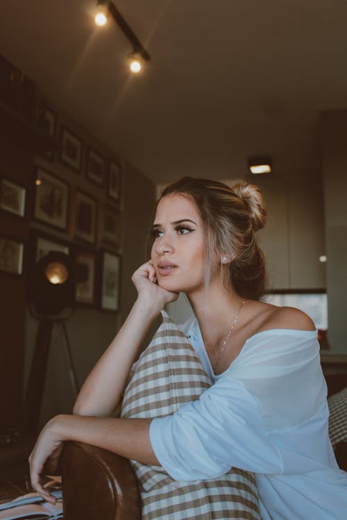 Woman Sitting on Chair