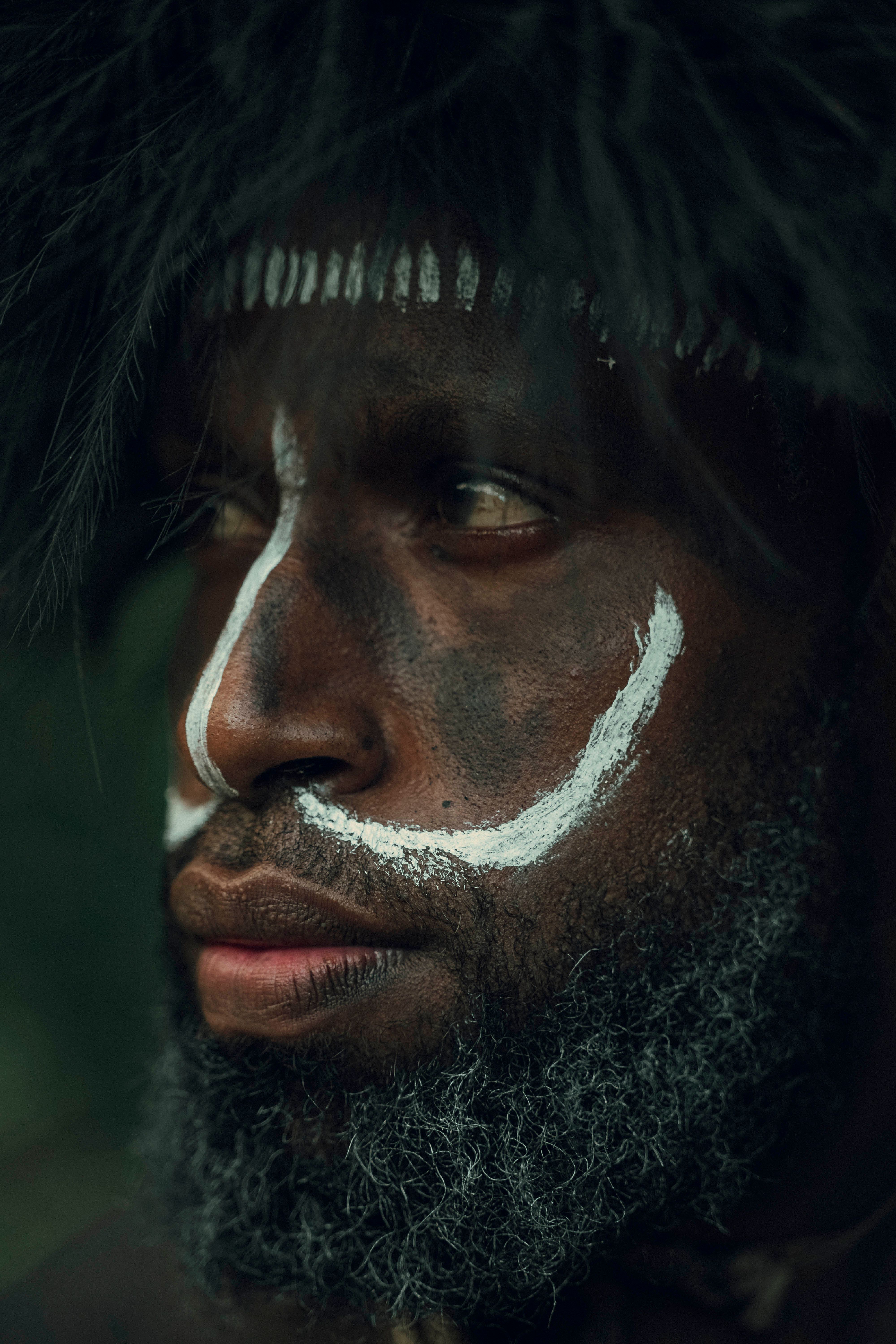 Portrait of Man with Traditional Face Paint · Free Stock Photo