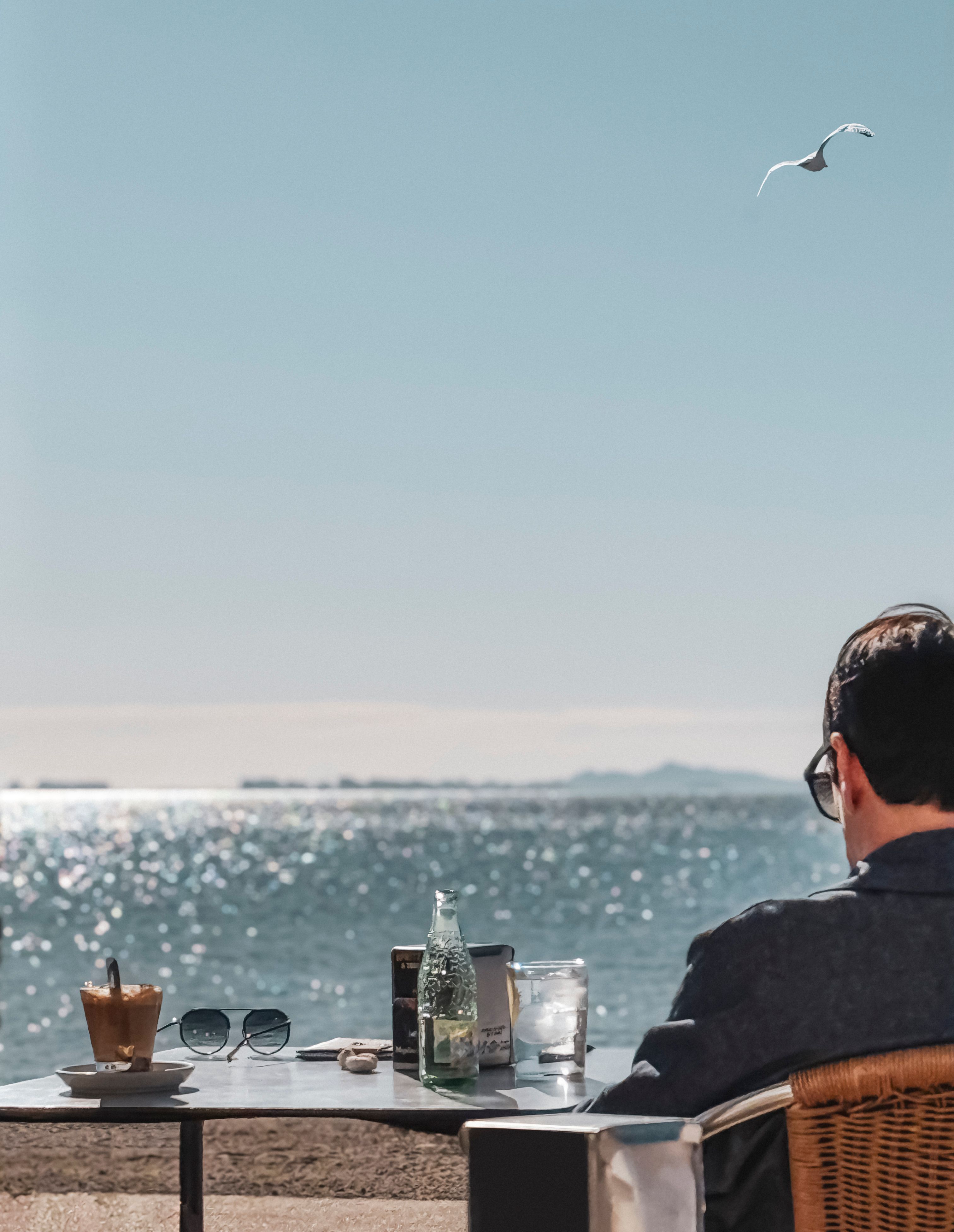 Relaxed beachside breakfast table in the morning with a view to the sea.