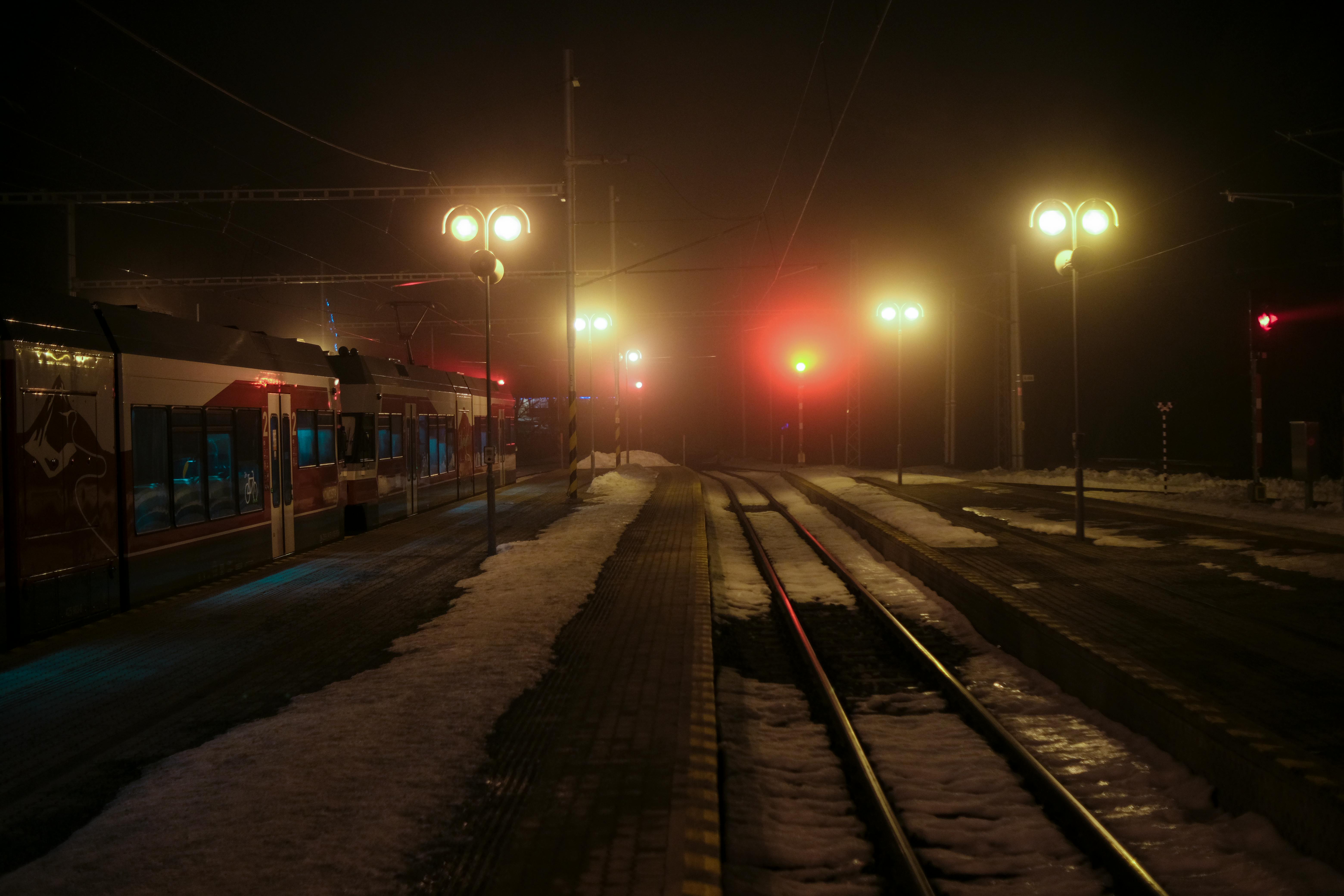 night train station with snow and lights
