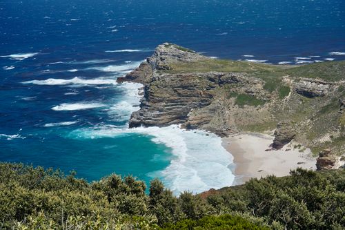 Free A breathtaking view of Cape Point's rugged coastline and turquoise waters, offering a glimpse into South Africa's natural beauty. Stock Photo