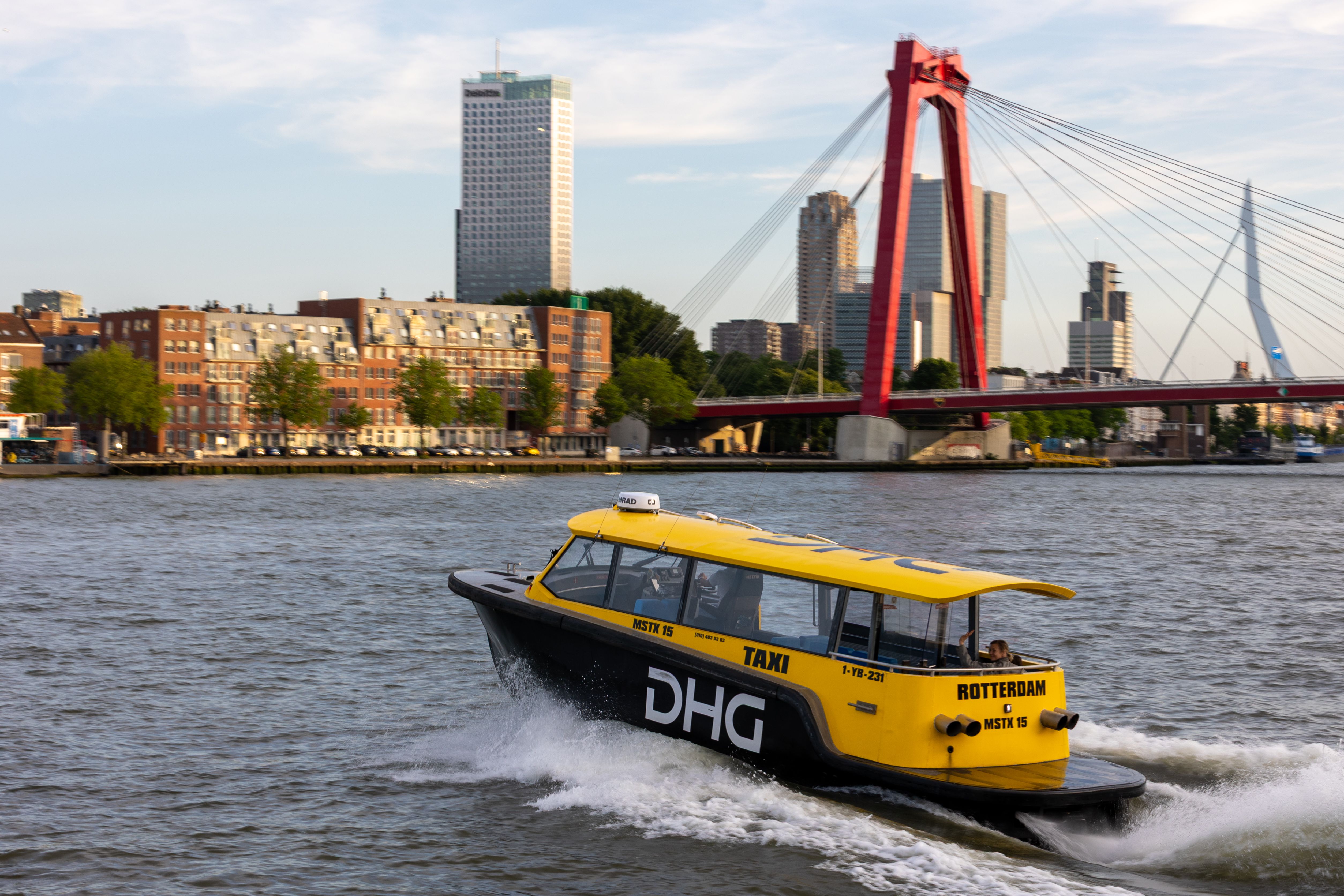 Vibrant Cityscape with Water Taxi in Rotterdam