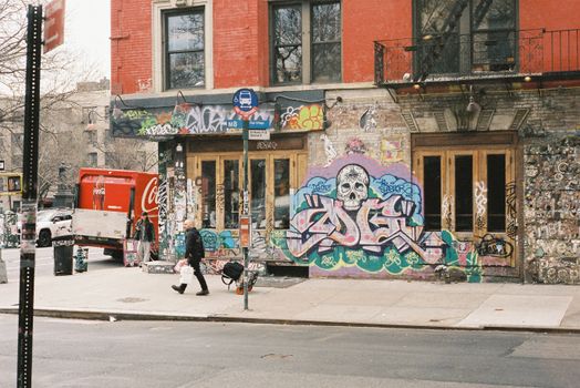Dynamic urban street corner featuring vibrant graffiti and a Coca-Cola truck.
