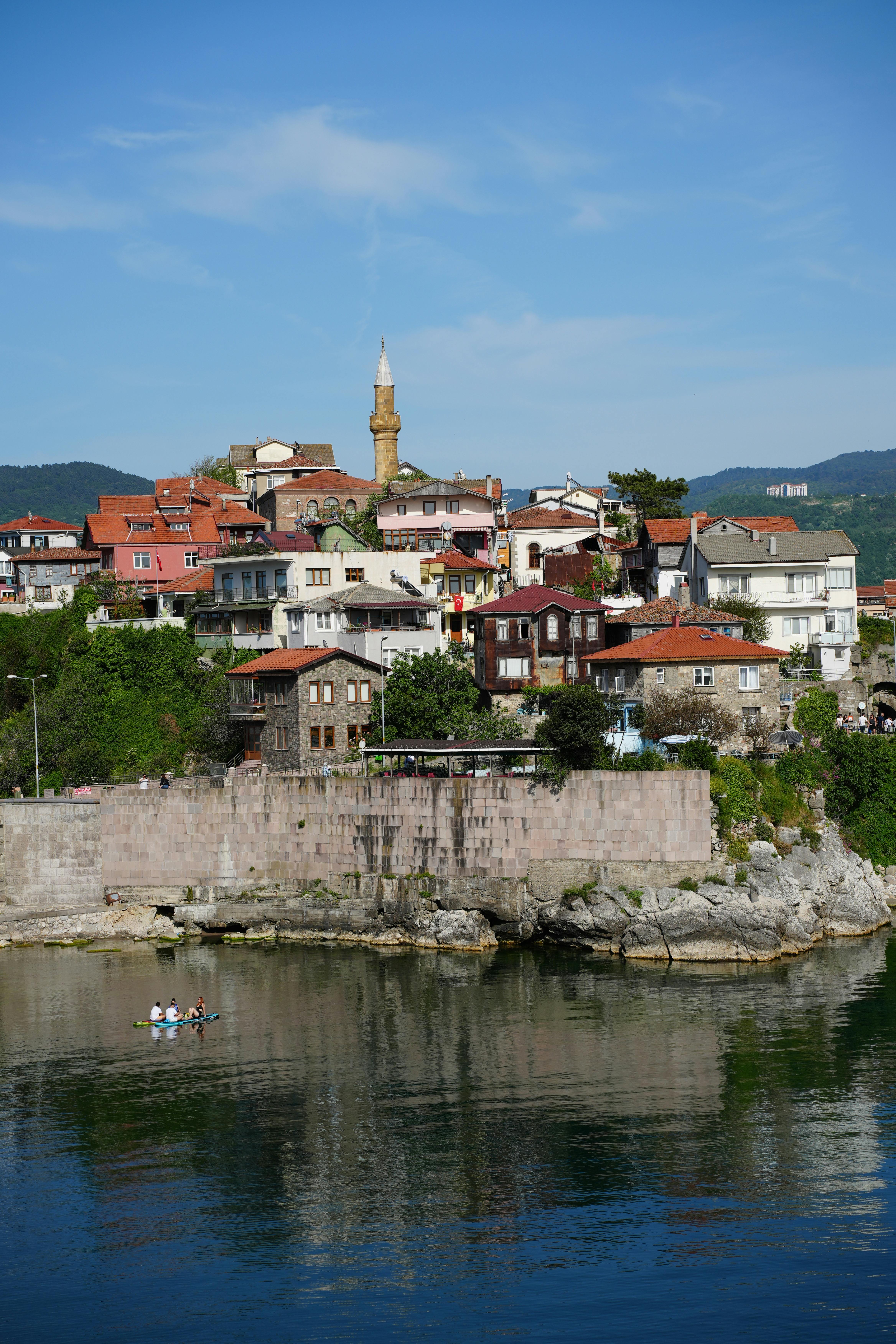 Charming view of Amasra town with its historic architecture and reflective waterfront.