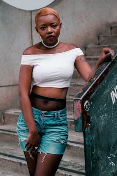 Stylish portrait of a woman posing outdoors in a fashionable outfit.