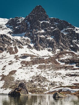 Stunning view of snow-covered mountain landscape in Pontresina, Switzerland.