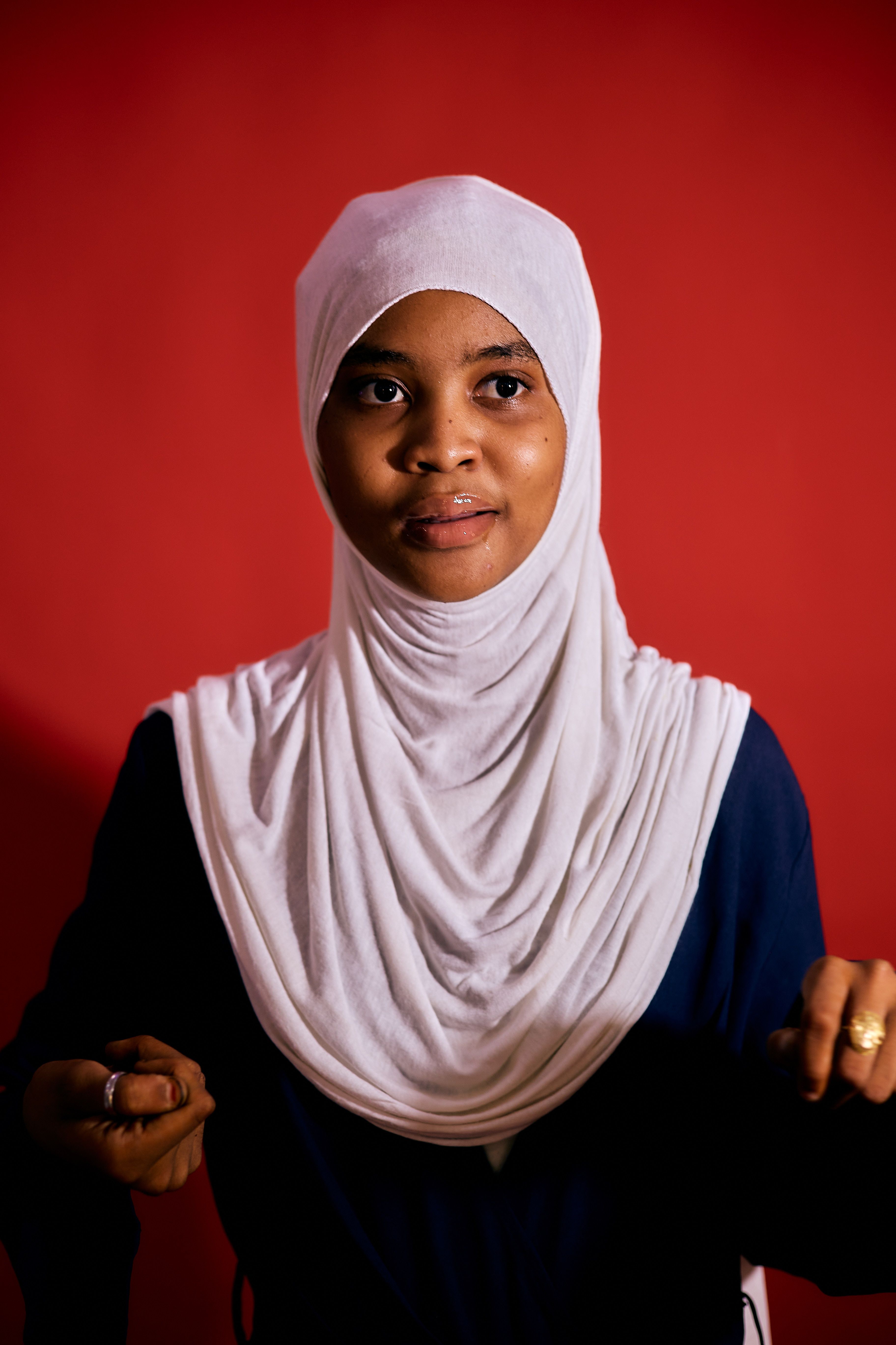 Portrait of Woman in Hijab Against Red Background · Free Stock Photo