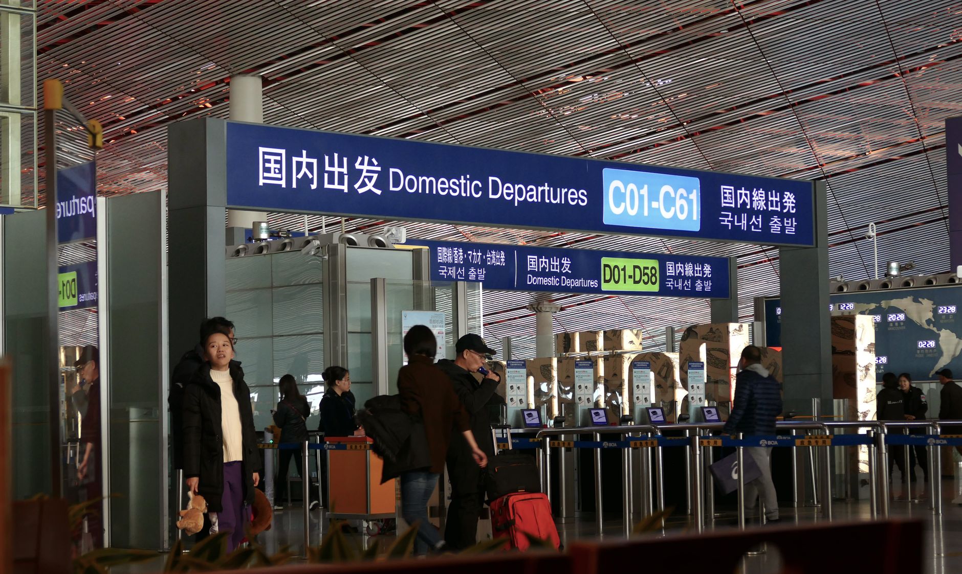 People moving through the domestic departures terminal at Beijing airport.
