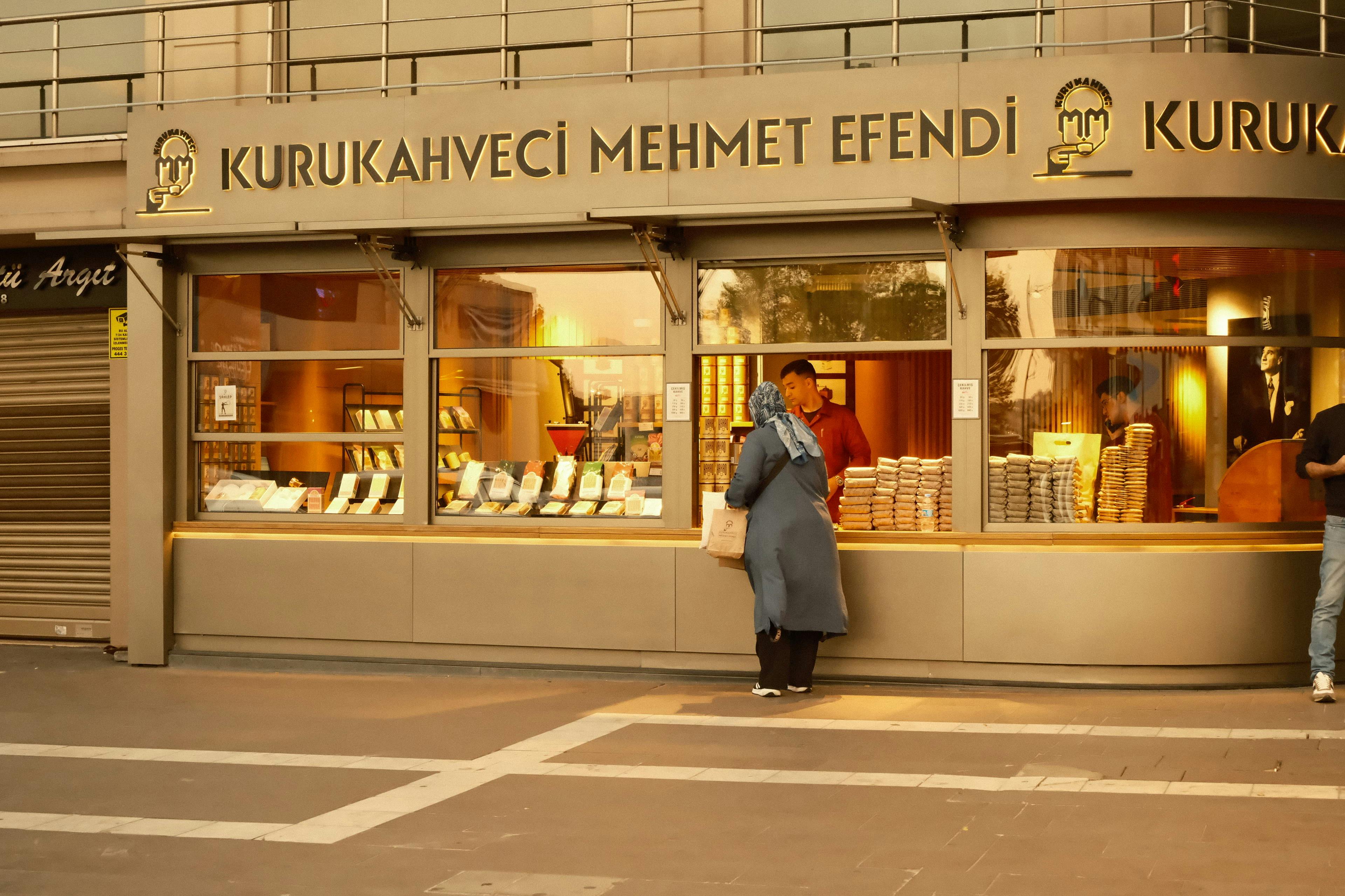 A customer at Kurukahveci Mehmet Efendi coffee shop in daylight.