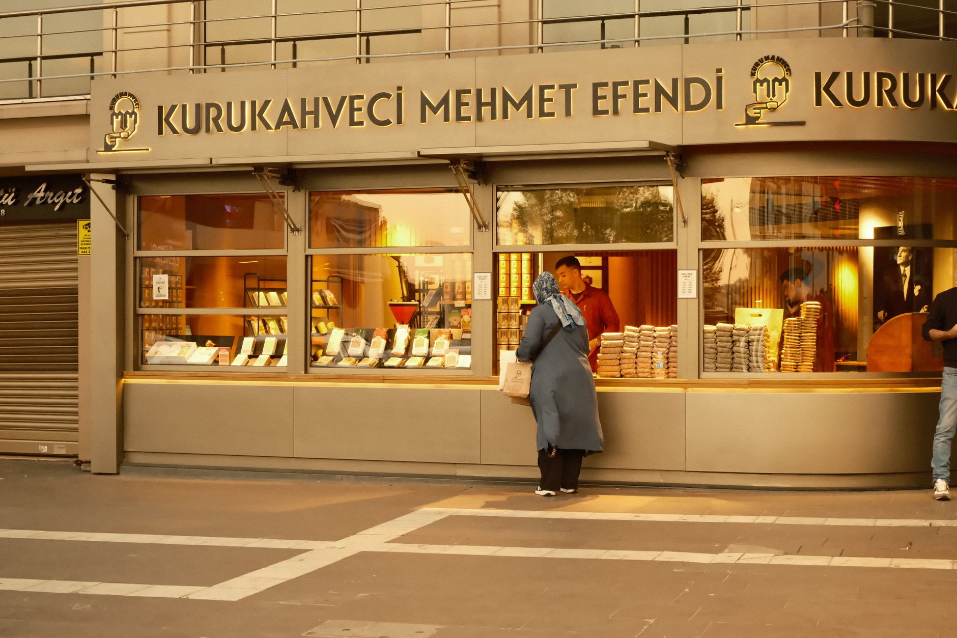 A customer at Kurukahveci Mehmet Efendi coffee shop in daylight.