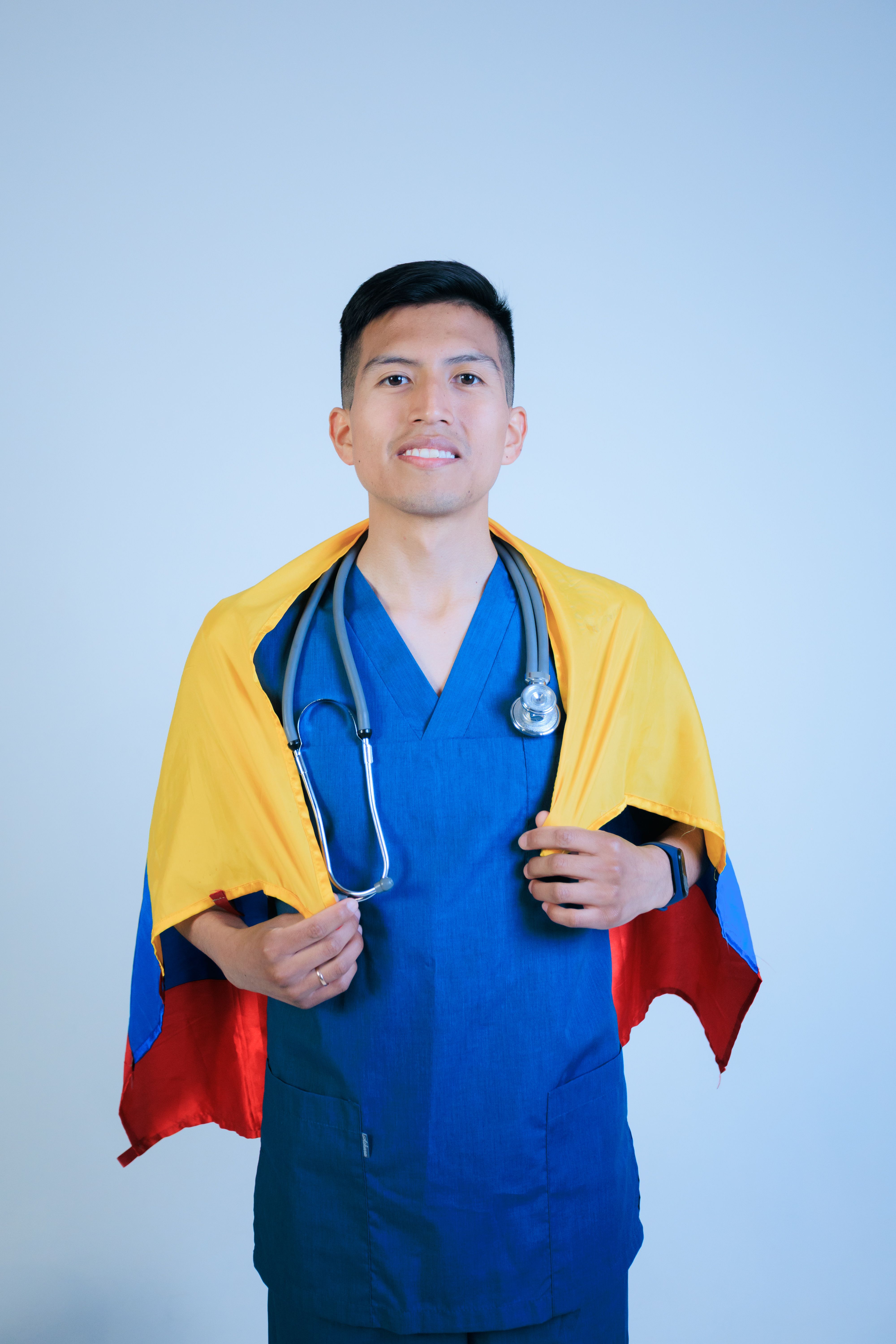 Young doctor with national flag cape and stethoscope, symbolizing pride and healthcare dedication.