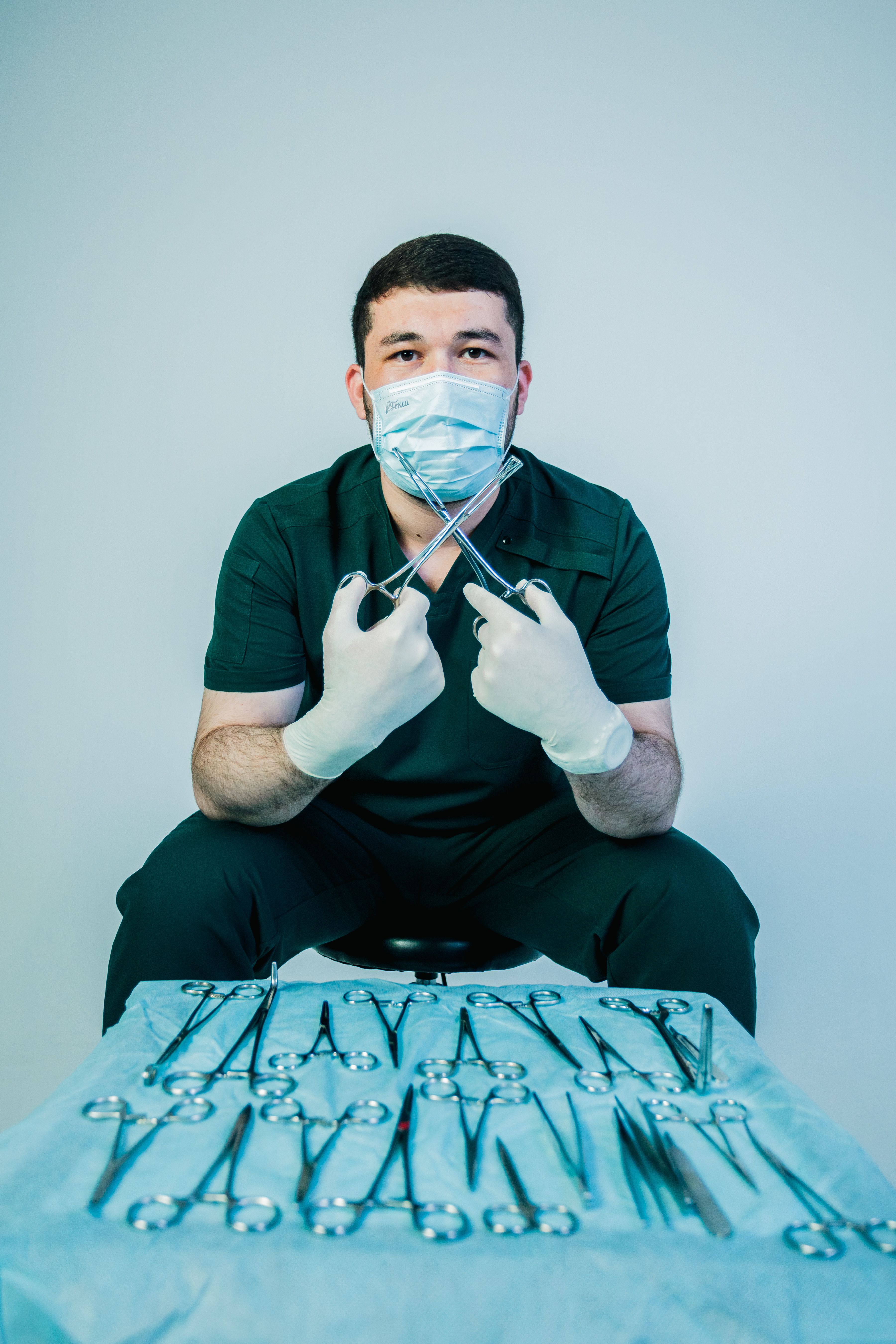 Surgeon with Instruments in Clinical Setting · Free Stock Photo