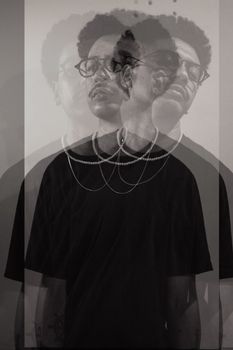 Creative multiple exposure image of a man creating an abstract visual effect.