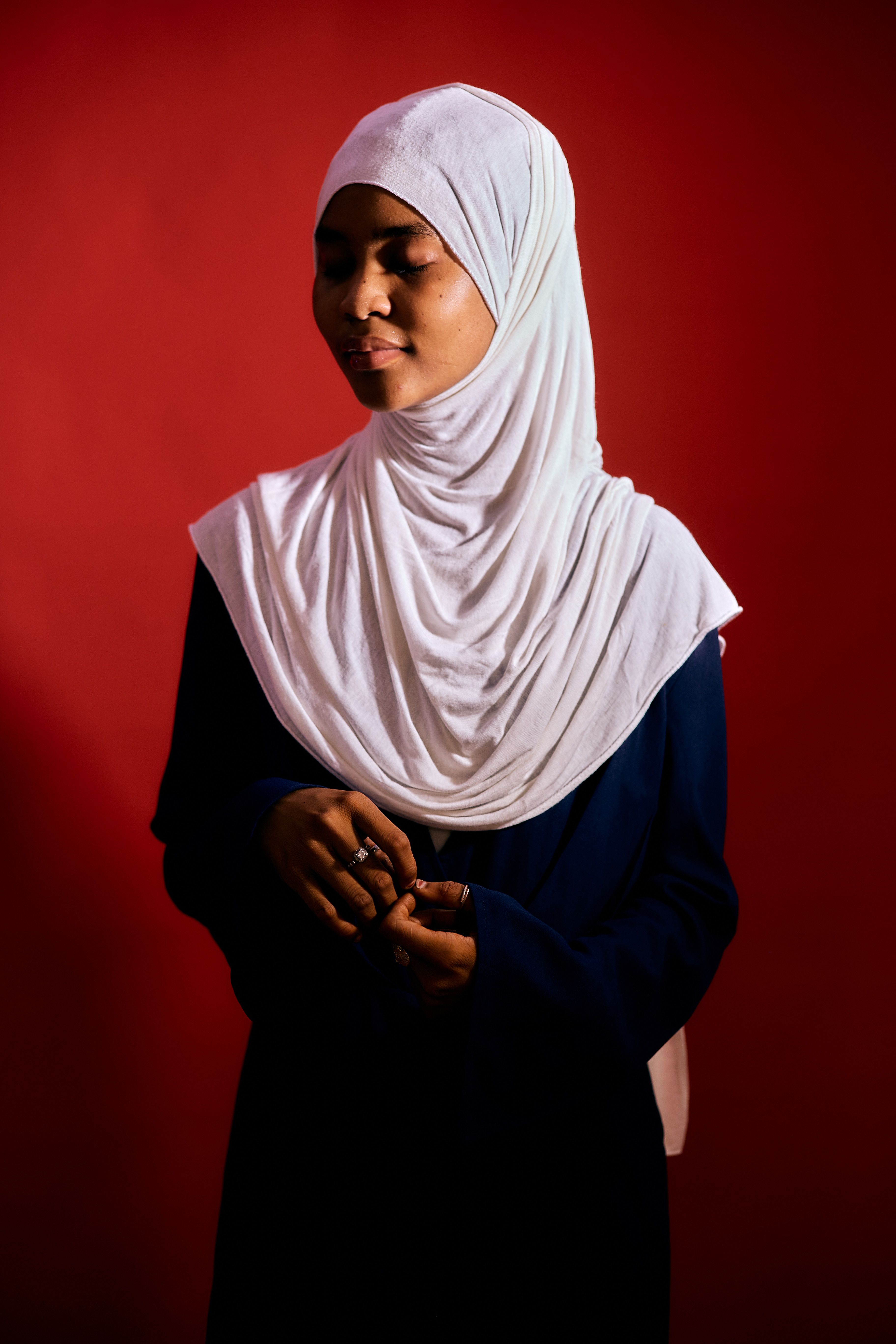 Portrait of Woman with White Hijab on Red Background · Free Stock Photo