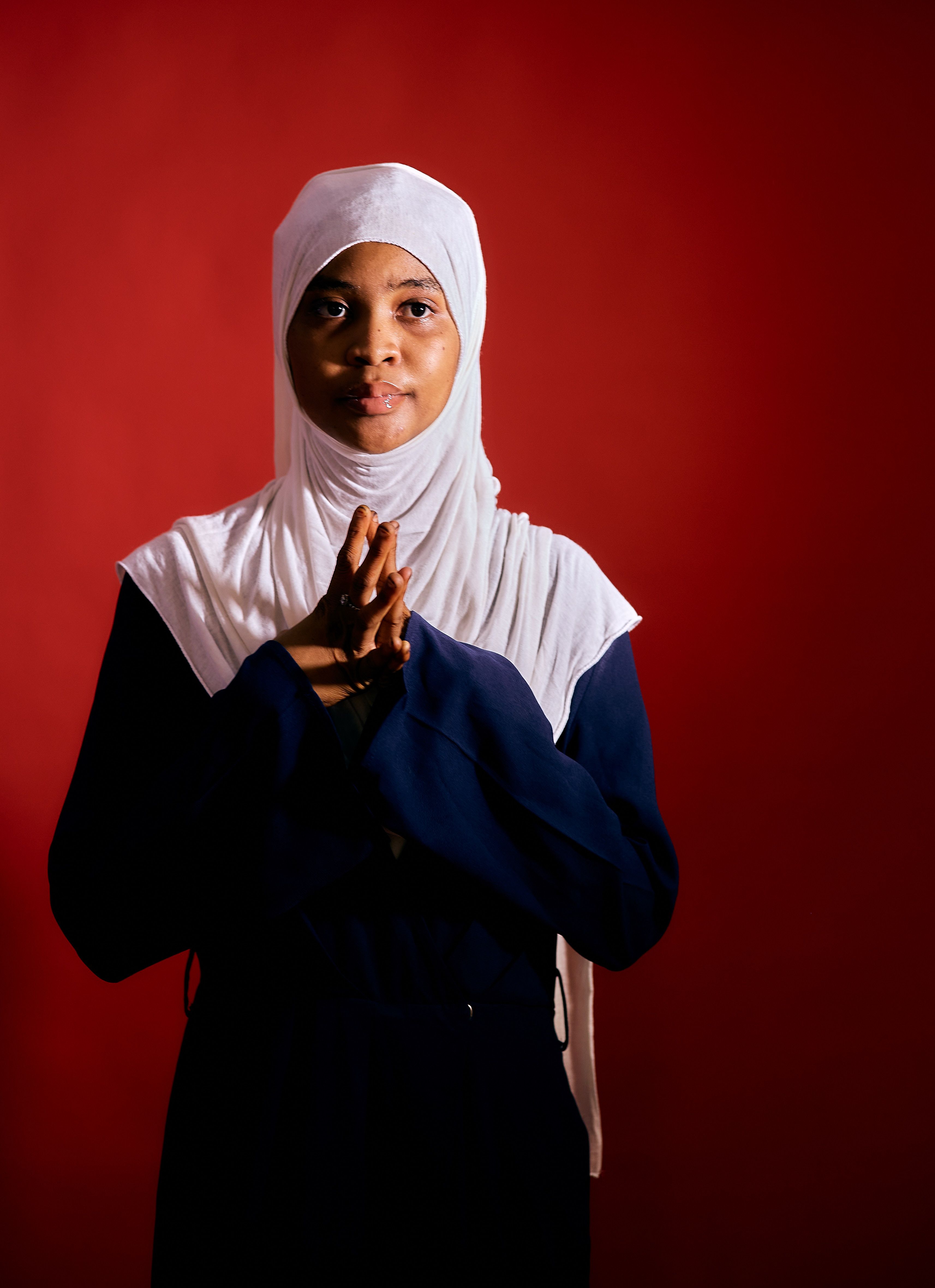 Portrait of a Woman in Traditional Attire on Red Background · Free ...