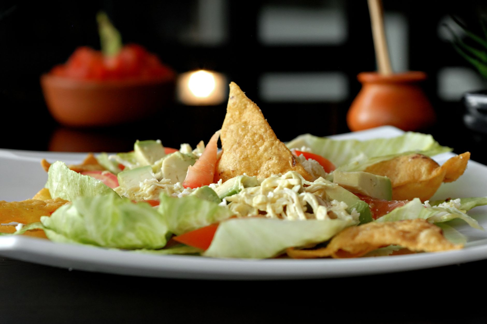 Delicious Snow Pea Salad with Avocado Recipe Vibrant Mexican salad featuring crisp lettuce, tortilla chips, avocado, and tomatoes.
