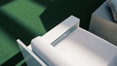 Sunlit Modern Patio Chair on Green Turf