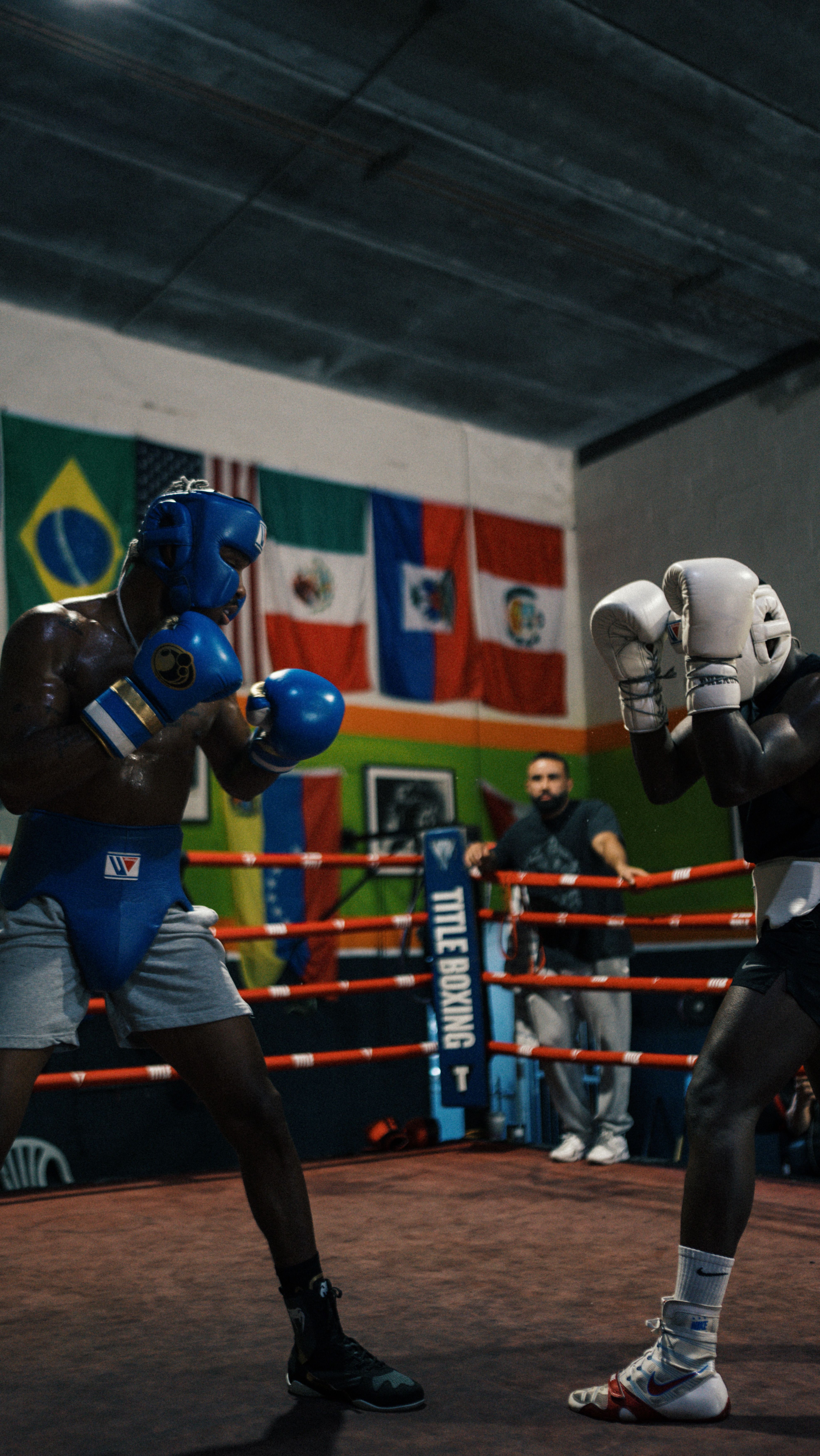 Intense Boxing Match in Gym Setting · Free Stock Photo