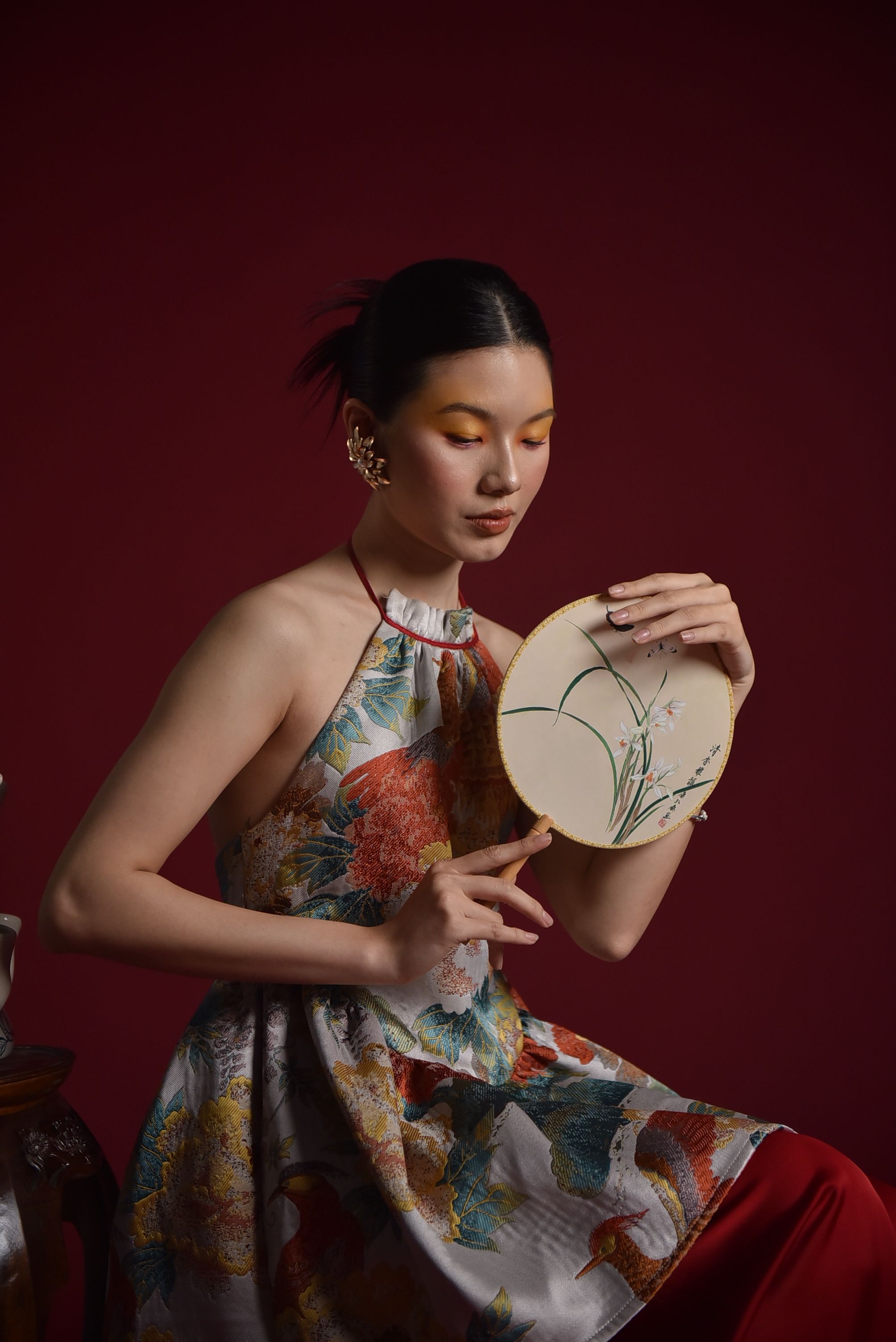 Elegant Woman in Traditional Dress with Fan · Free Stock Photo