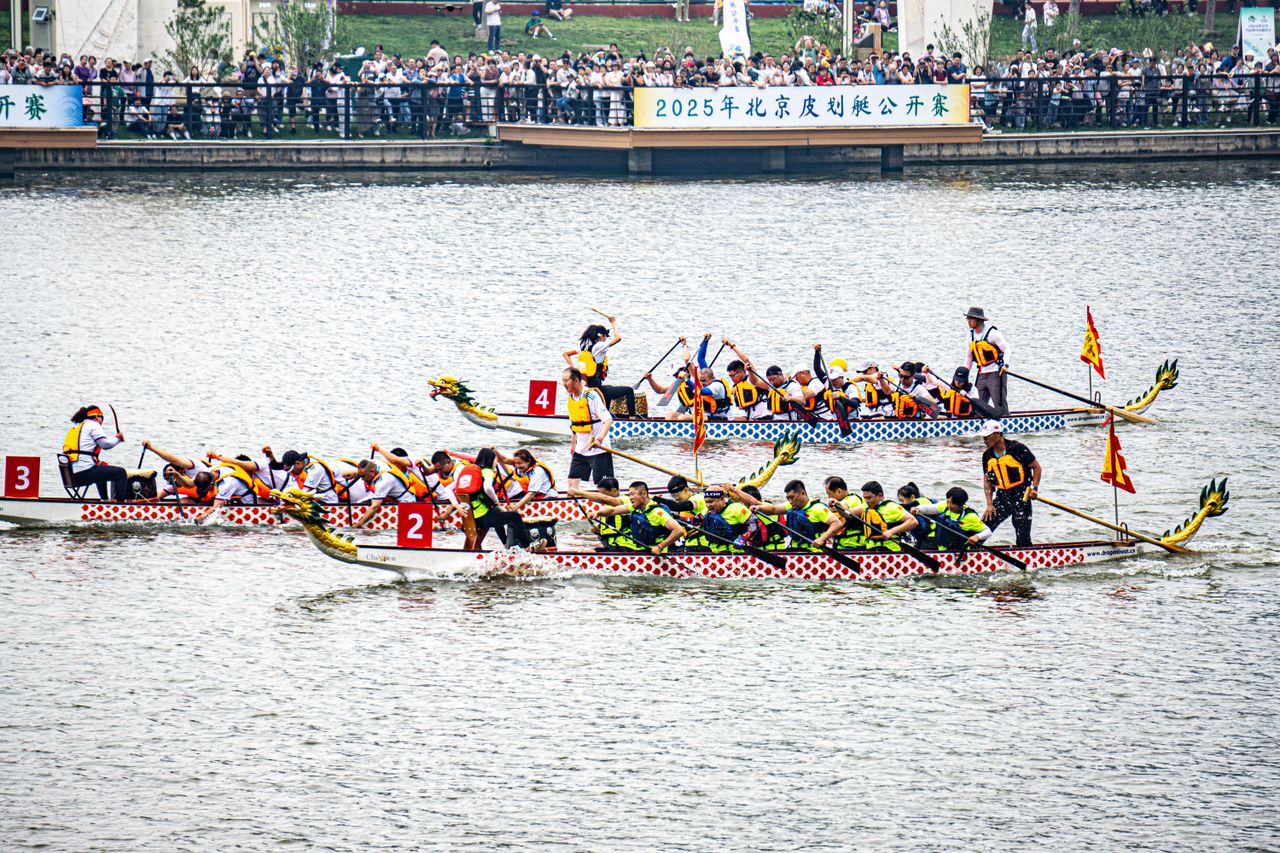 Dragon boat race with rowers on a river