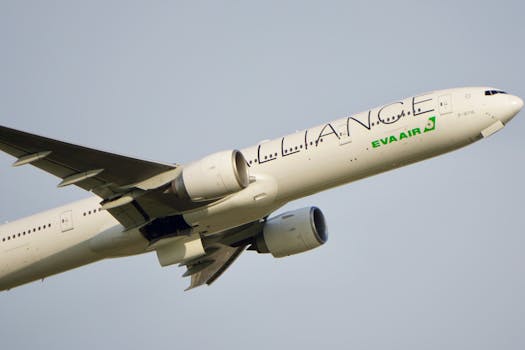 Side view of a commercial airplane flying, showcasing aviation technology and sleek design.