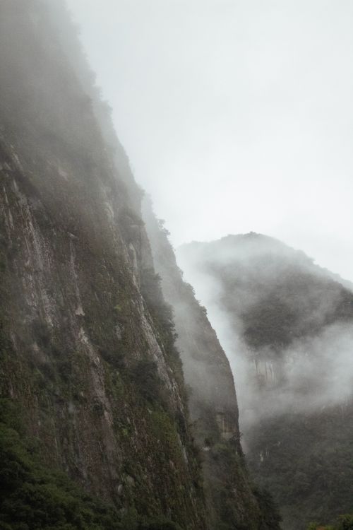 Free Dramatic mist-covered mountains capture the mystery and beauty of Cuzco, Perú. Stock Photo