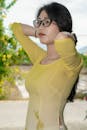 Woman in Traditional Yellow Ao Dai Outdoors