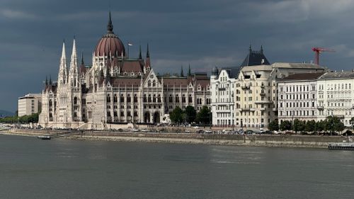 Free Stunning view of the Hungarian Parliament Building alongside the Danube River in Budapest. Stock Photo