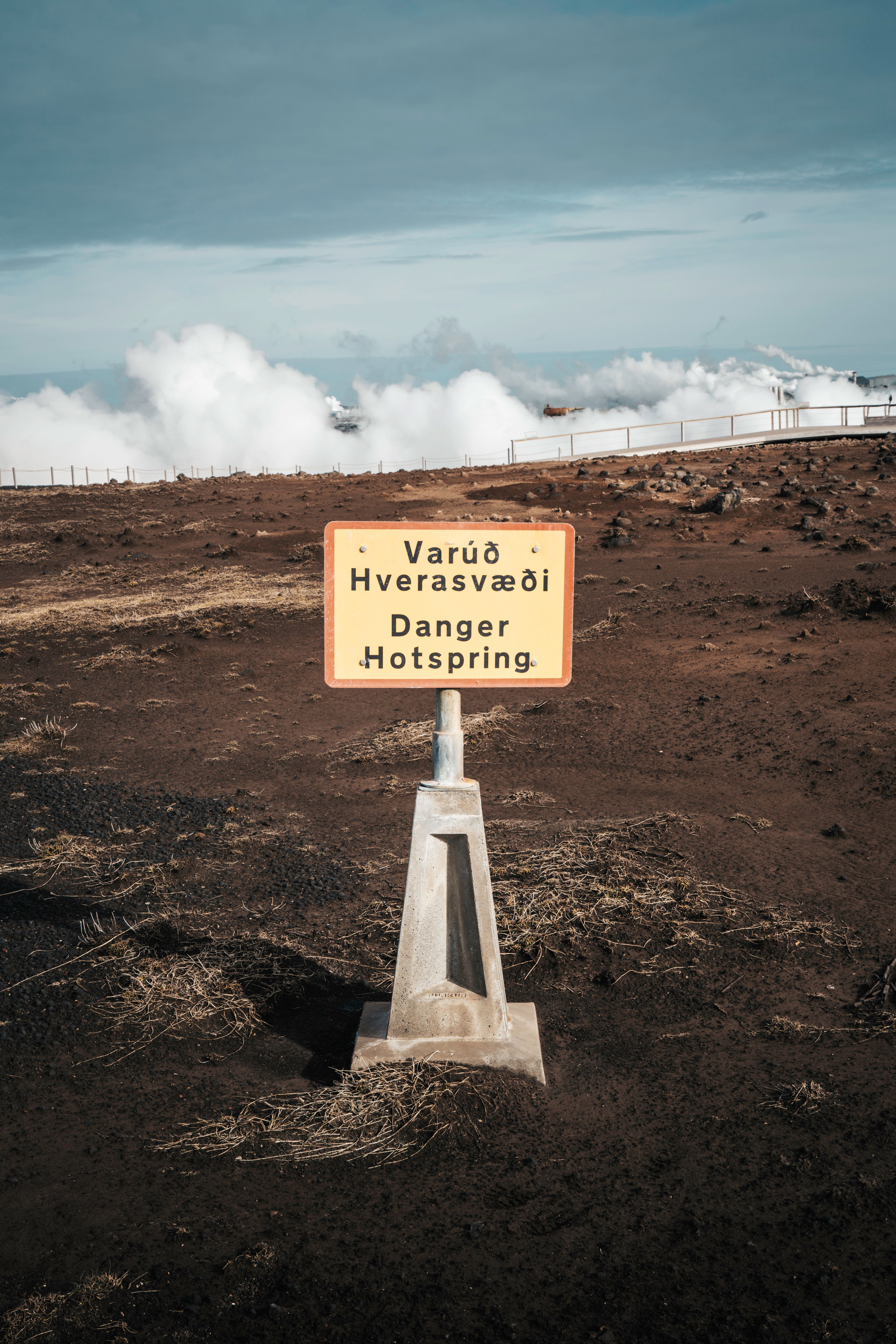 Caution Hot Spring Sign in Icelandic Landscape · Free Stock Photo