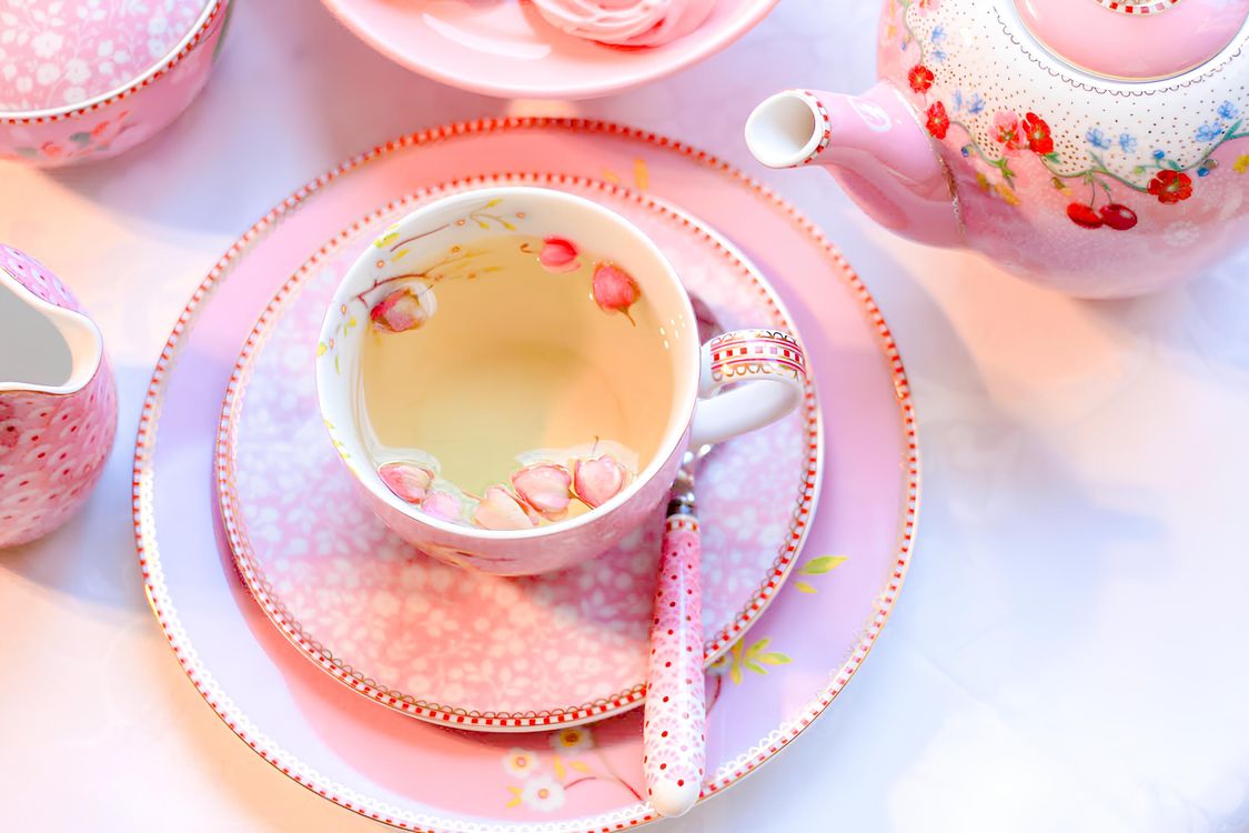 Elegant Pink Tea Set with Floral Motifs · Free Stock Photo