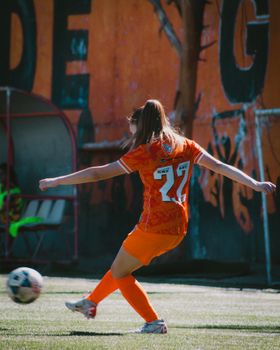 Dynamic shot of a female soccer player in action during a match in Chile.