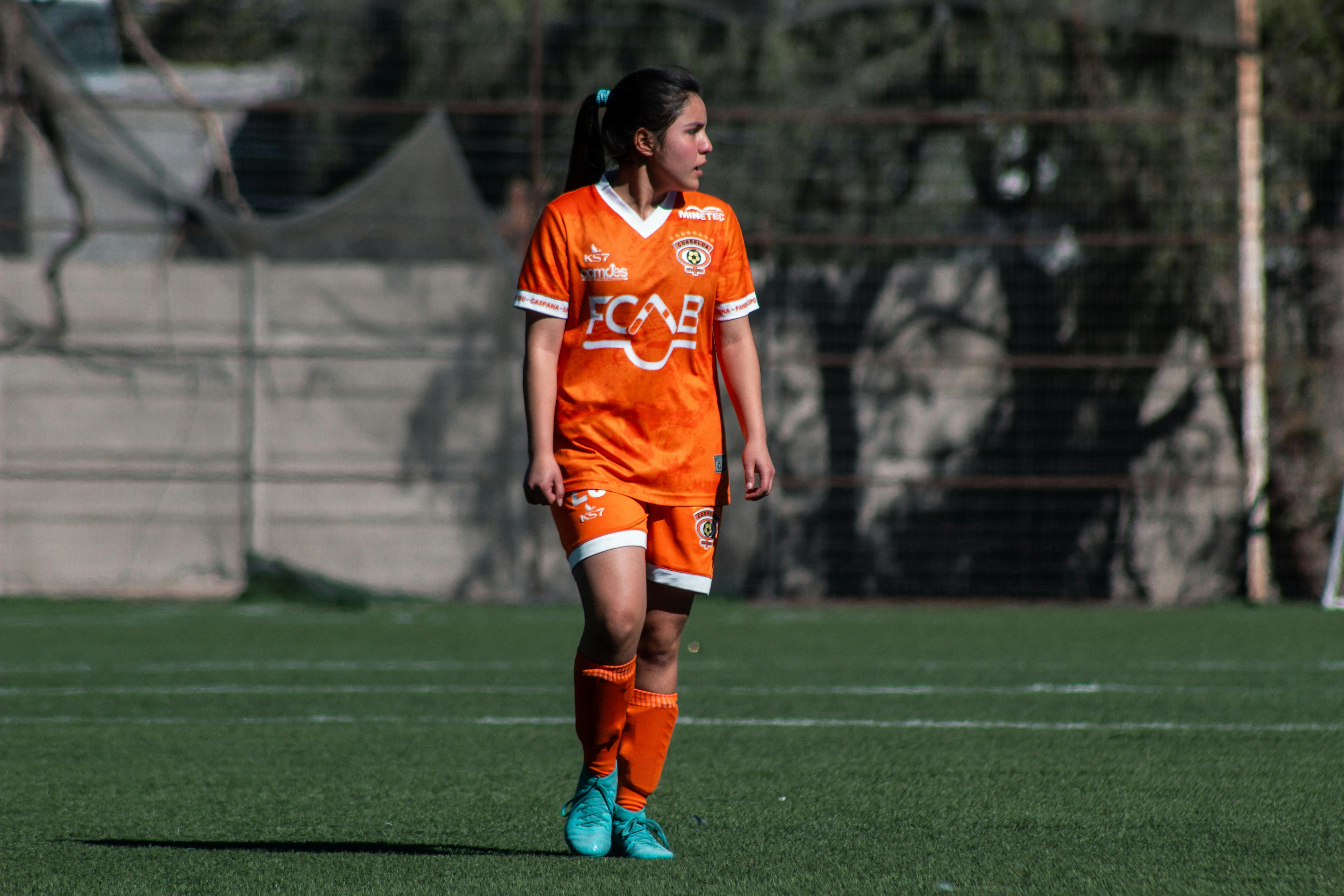 female soccer player in action on chilean field