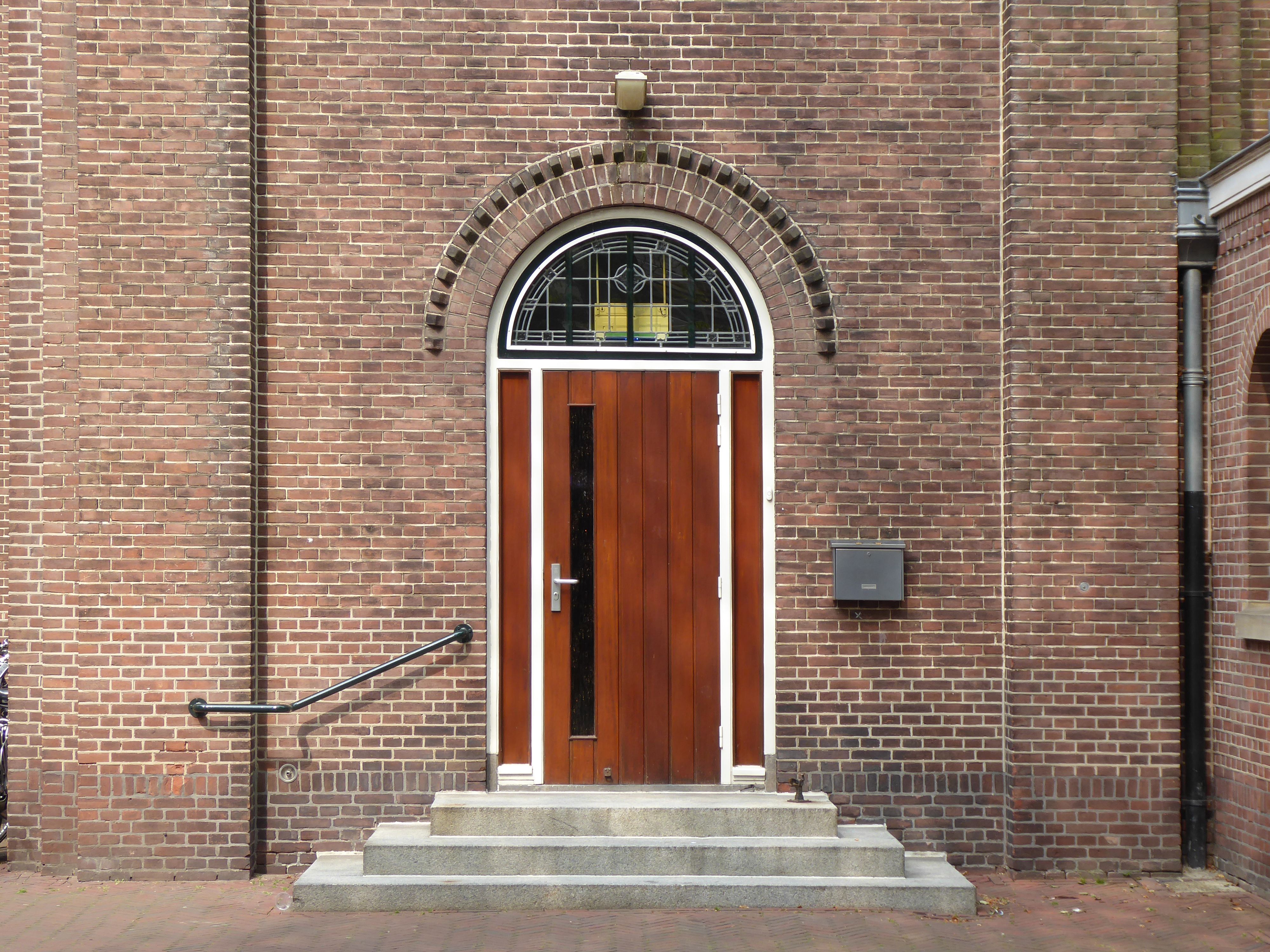 Wood; doors and their frames and thresholds, (of other than tropical wood)