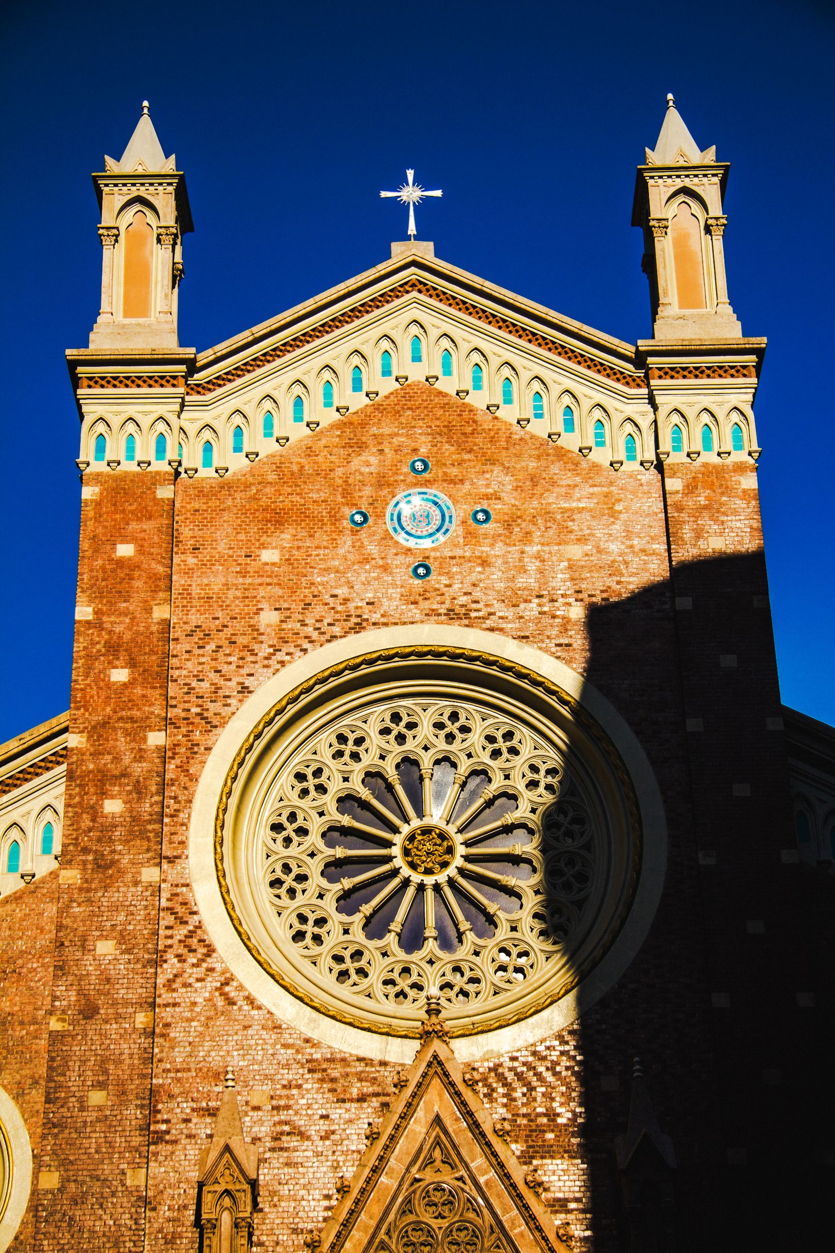 Majestic Gothic Church Facade Under Blue Sky · Free Stock Photo