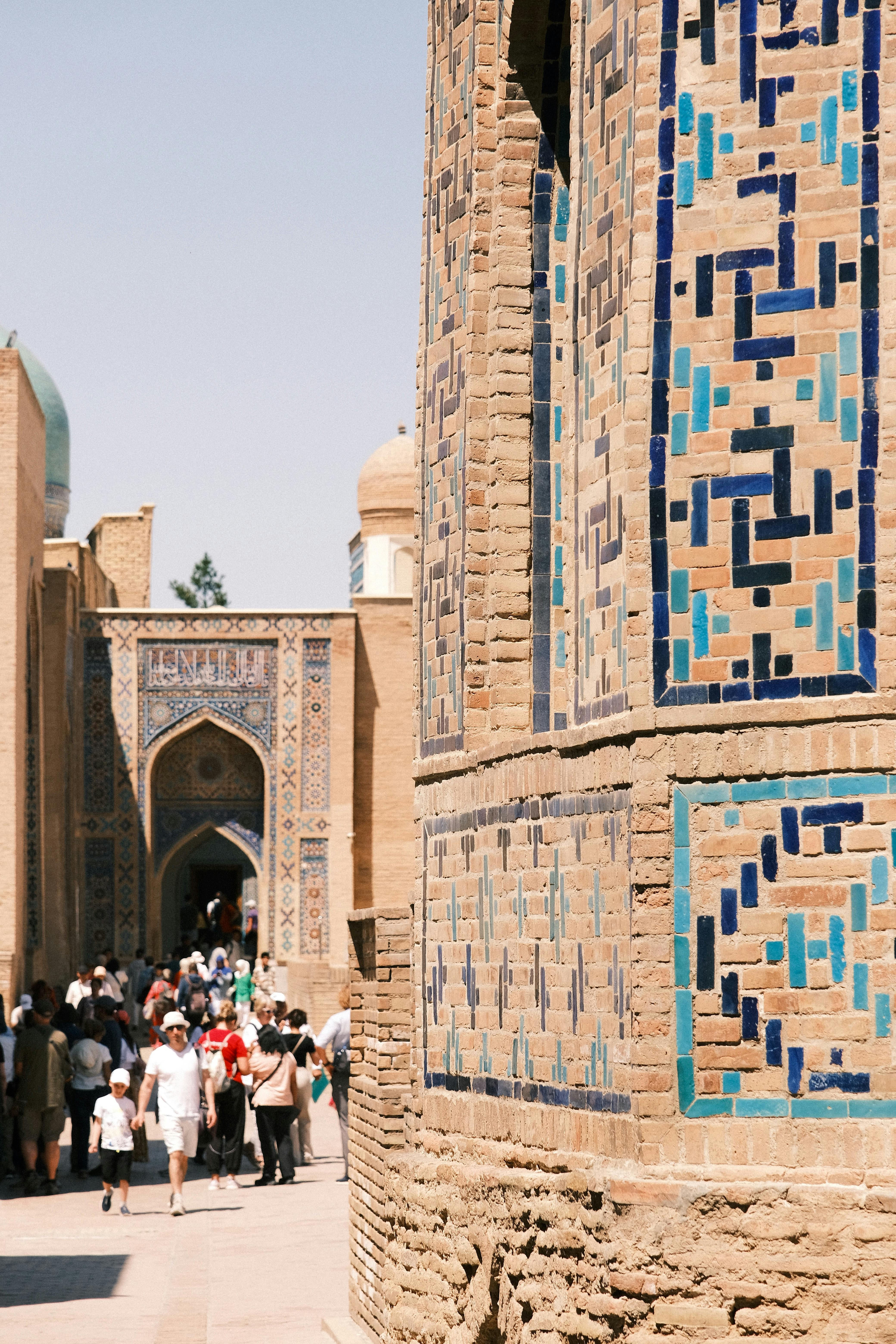 tourists exploring historic architecture in uzbekistan