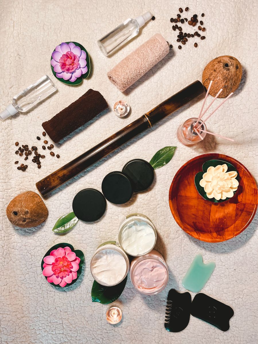 Spa skincare products, flowers, and oils